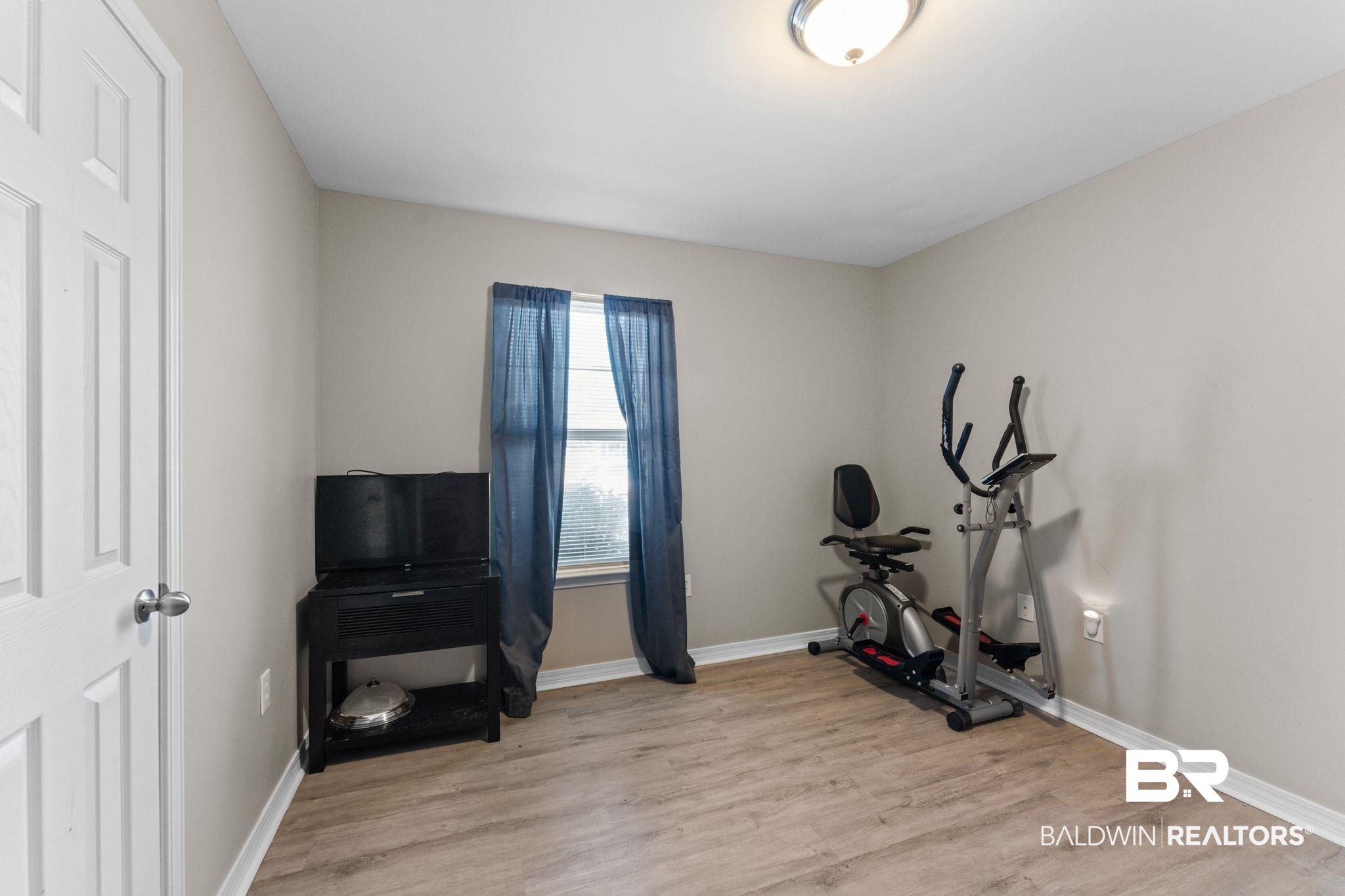 1549 Majesty Loop Foley, AL 36535 - Photo 17 of 25 Workout area with light wood-style flooring and baseboards