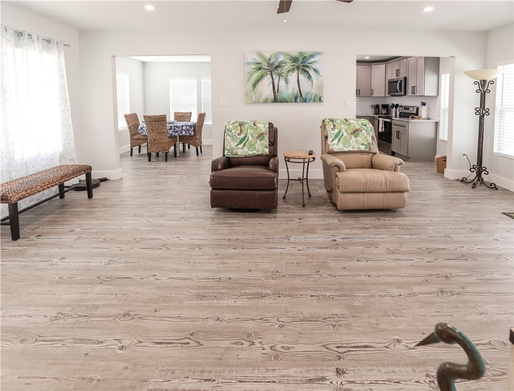 125 Lakewood Drive Mathis, TX 78368 - Photo 12 of 39 a living room with furniture and a fireplace