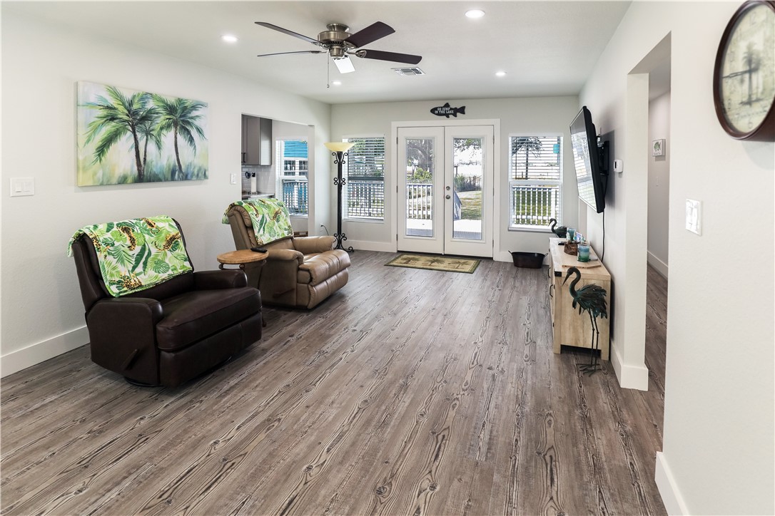 125 Lakewood Drive Mathis, TX 78368 - Photo 2 of 39 a living room with furniture and a wooden floor