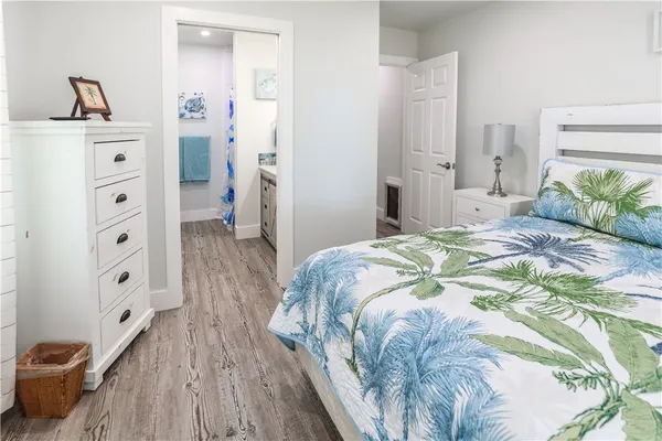 a bathroom with a double vanity sink mirror and toilet