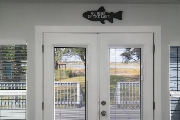 a view of a house with backyard and deck
