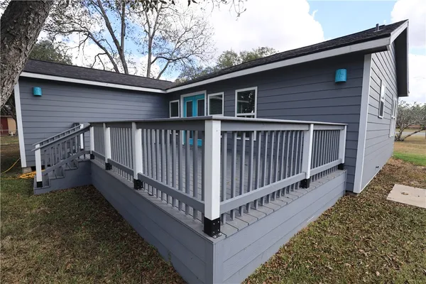 a view of a wooden deck on the house