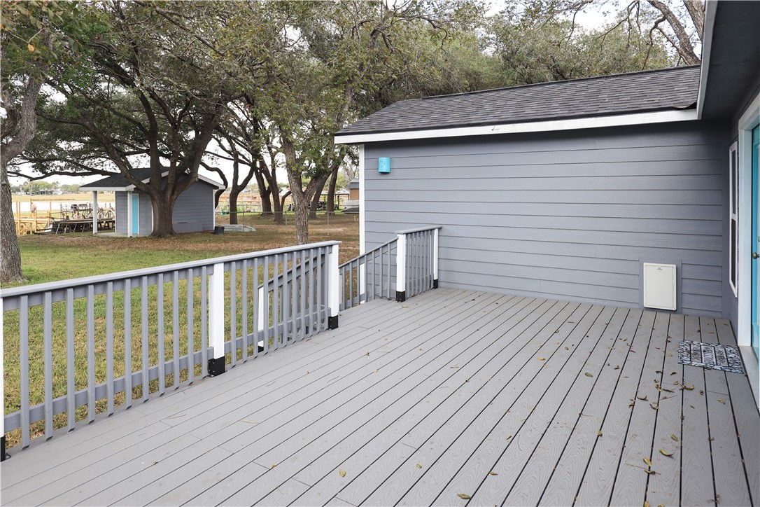 125 Lakewood Drive Mathis, TX 78368 - Photo 28 of 39 a view of a wooden deck on the house