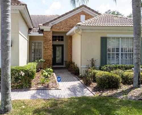 65 Calliope Street Ocoee, FL 34761 - Photo 60 of 60 a front view of a house with garden