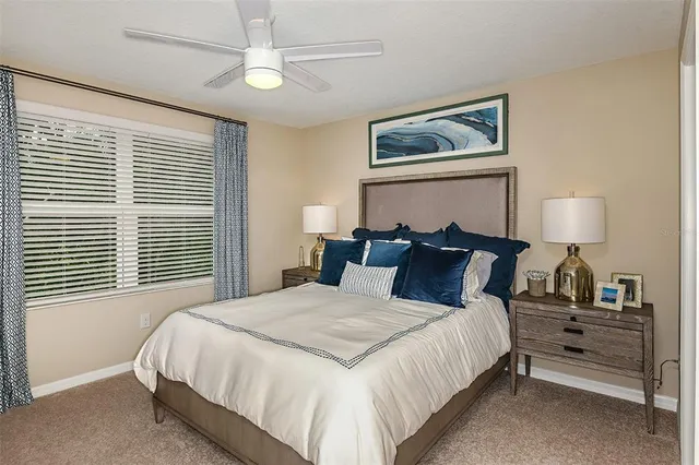 a bedroom with bed and a chandelier