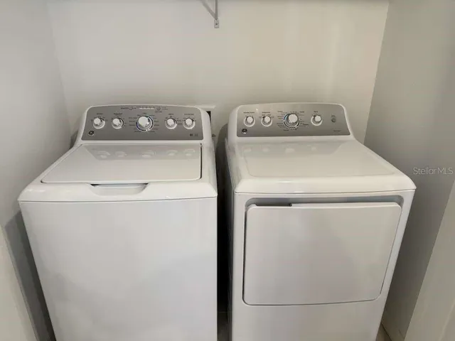 a utility room with dryer and washer