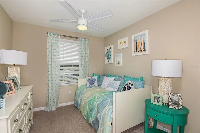 a bed room with a bed and a lamp