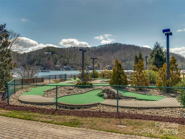 a view of a swimming pool with a yard