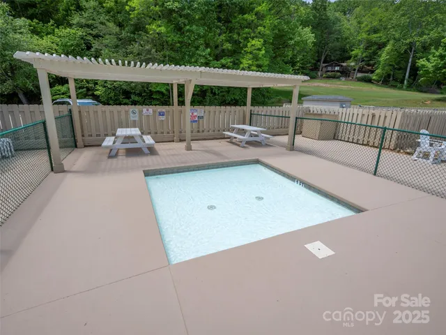 a view of swimming pool with outdoor seating