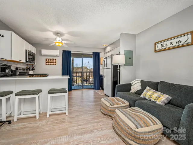 a bedroom with bed and wooden floor