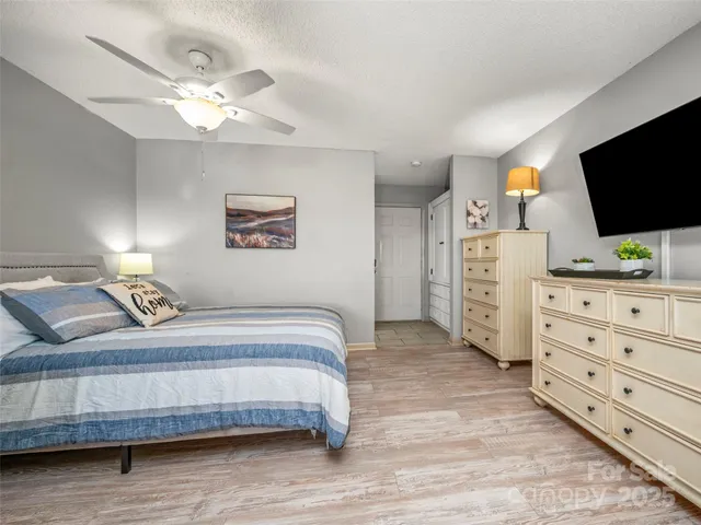 a kitchen with stainless steel appliances granite countertop a stove and white cabinets