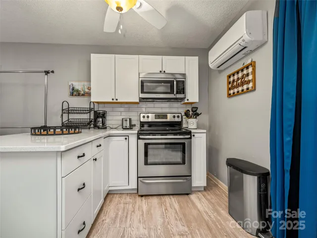 a white refrigerator freezer and a dishwasher in a kitchen