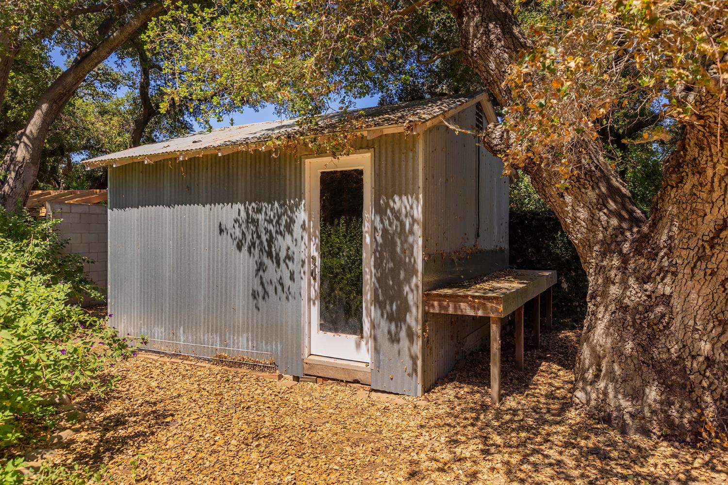 840 Fairview Road Ojai, CA 93023 - Photo 28 of 30 a backyard of a house with table and chairs