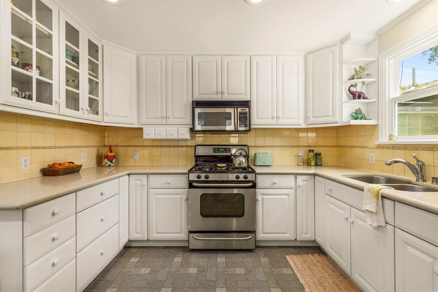 840 Fairview Road Ojai, CA 93023 - Photo 4 of 30 a kitchen with cabinets stainless steel appliances and a sink
