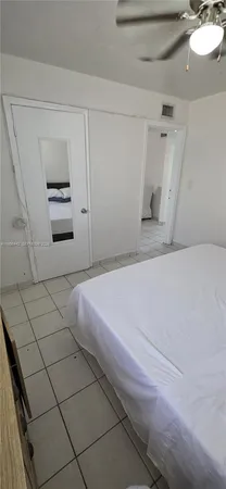 a bedroom with a bed and a cabinets