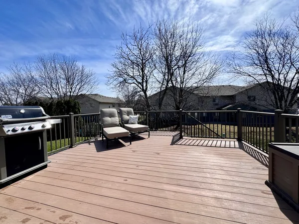 a park view with wooden deck and trees