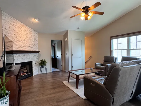 a living room with furniture and a fireplace