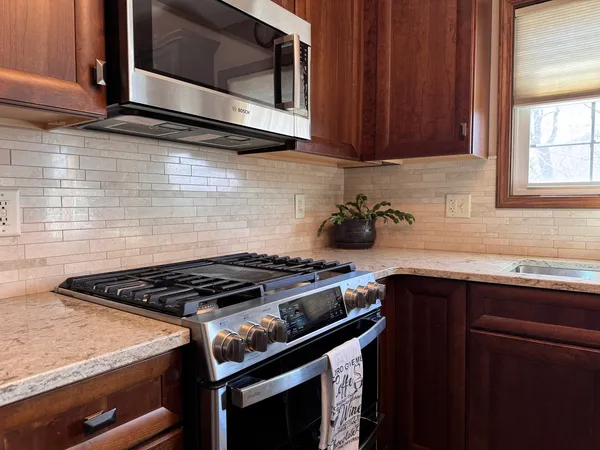 a kitchen with a stove and a microwave