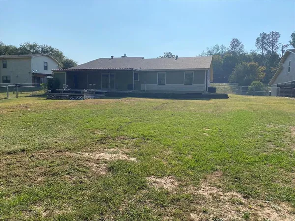 a view of a swimming pool with an outdoor space and seating area