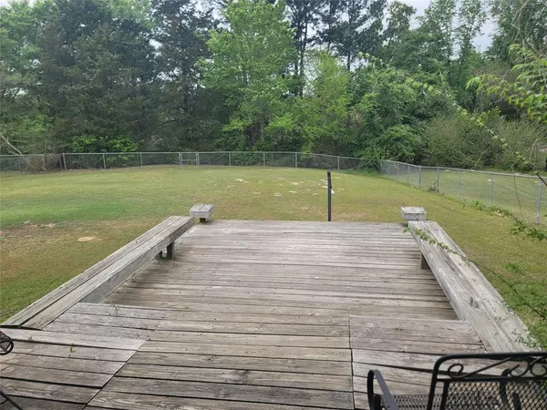 a view of a lake with a wooden floor