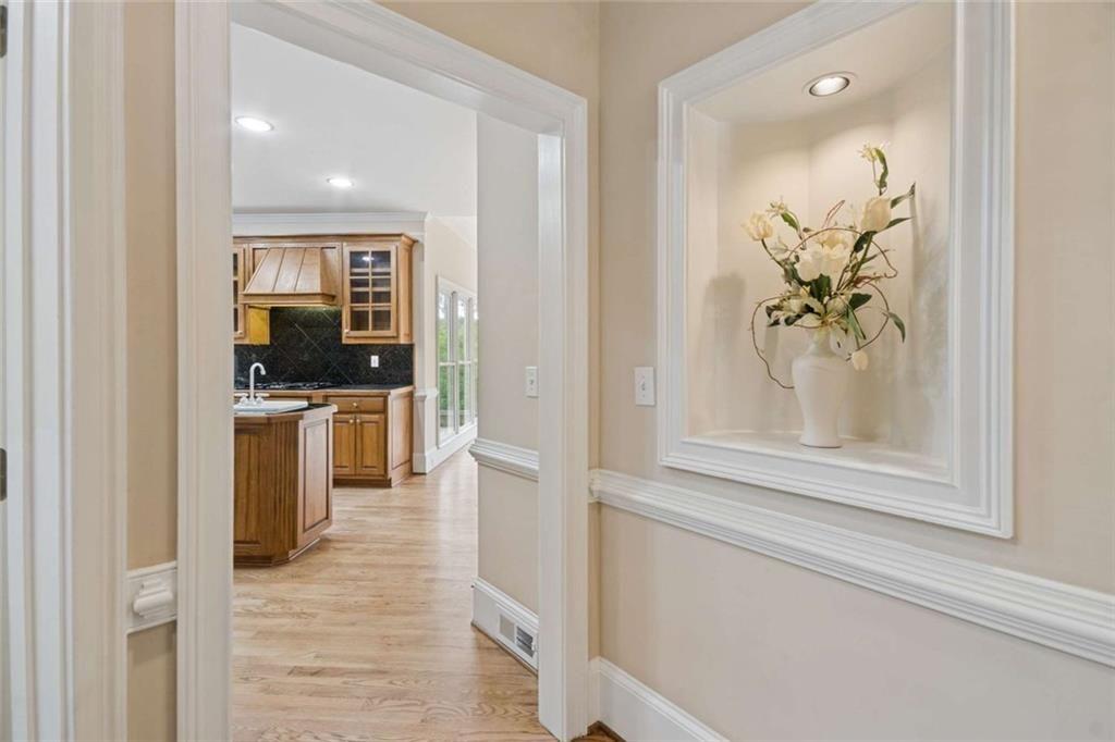 2628 High Street Southwest Conyers, GA 30094 - Photo 14 of 53 a hallway with cabinets and wooden floor