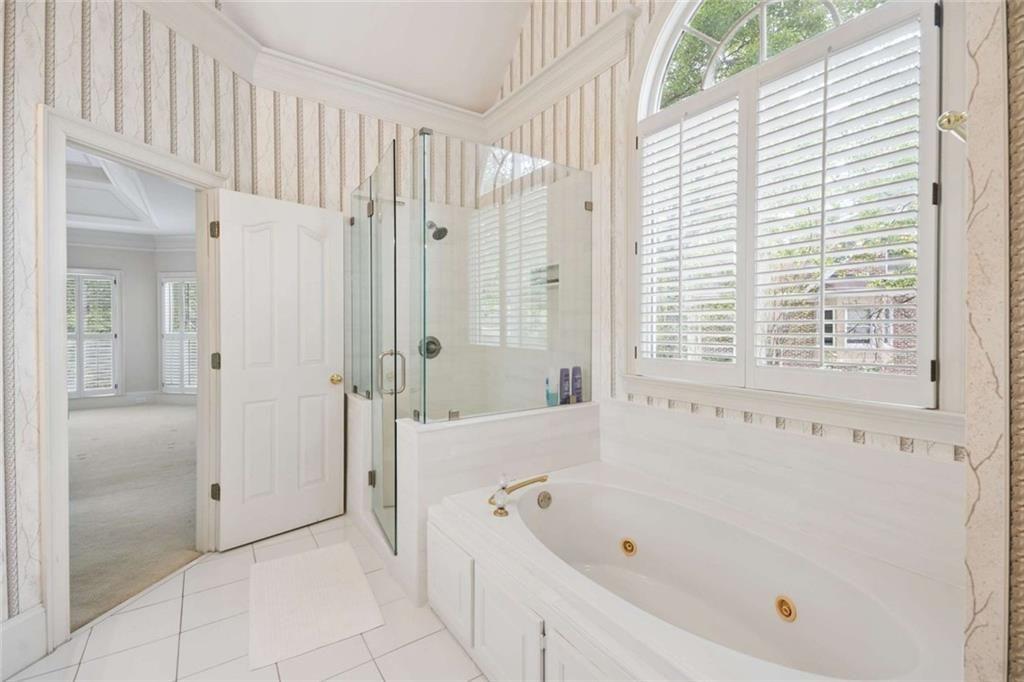 2628 High Street Southwest Conyers, GA 30094 - Photo 27 of 53 a bathroom with a bathtub and shower