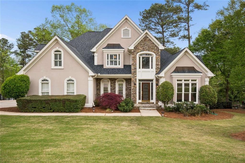 2628 High Street Southwest Conyers, GA 30094 - Photo 4 of 53 a front view of a house with a yard