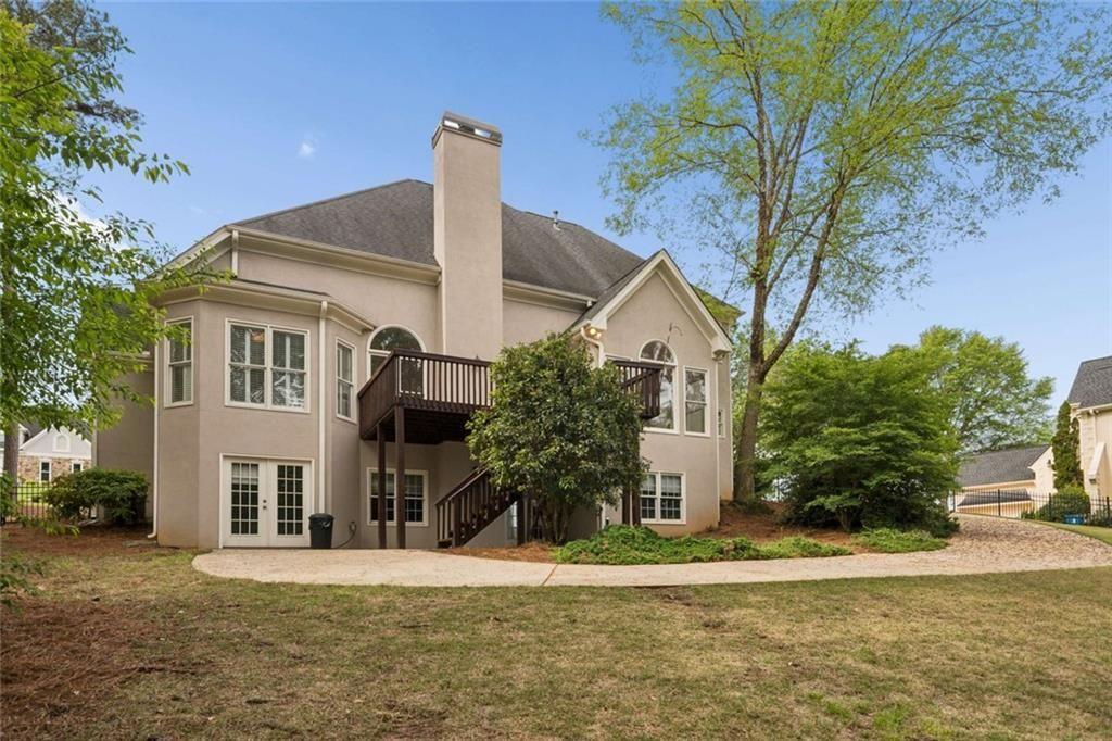 2628 High Street Southwest Conyers, GA 30094 - Photo 50 of 53 a front view of a house with a yard and trees
