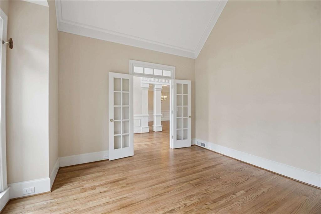 2628 High Street Southwest Conyers, GA 30094 - Photo 10 of 53 an empty room with wooden floor and windows