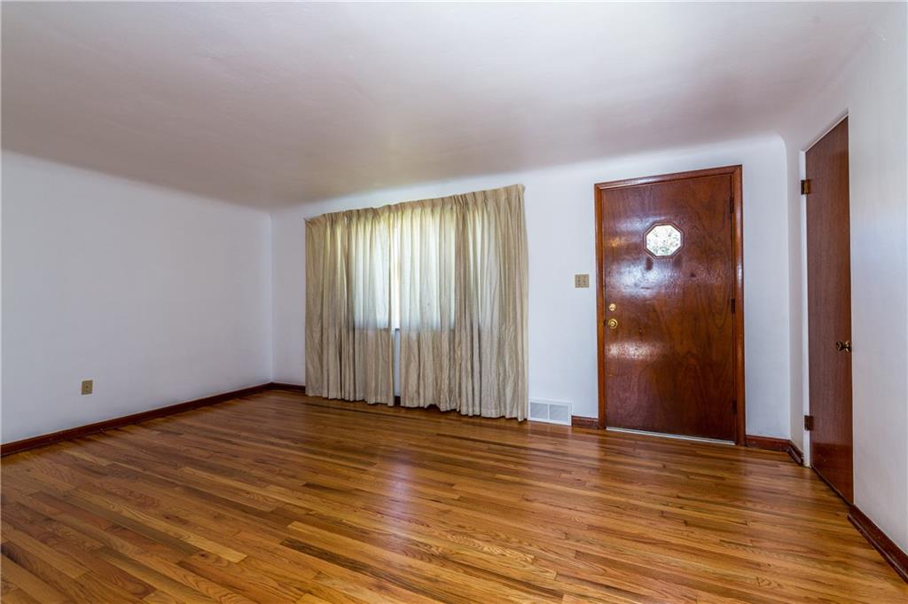 Living Room.  Refinished original hardwood floors.