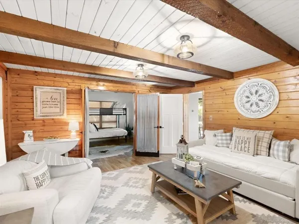 a living room with furniture and a clock