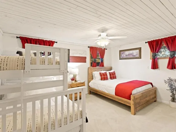 a bedroom with furniture and a baby bed