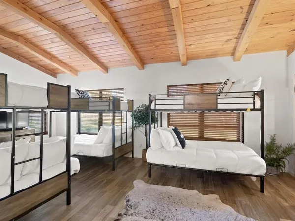 a outdoor space with lots of wooden furniture