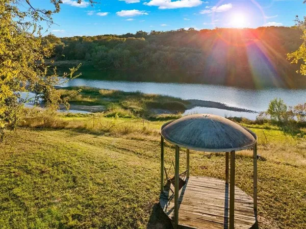 a view of a swimming pool with a yard