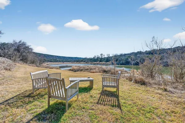 a view of a chair and table in the patio
