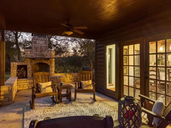 a living room filled with furniture and a fireplace
