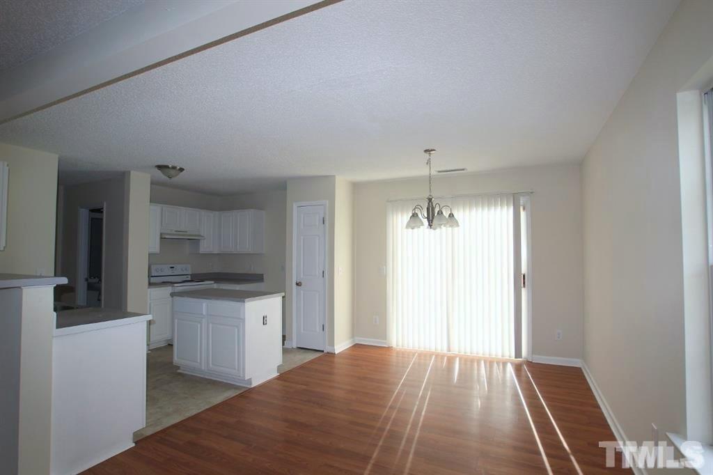 5505 Marthonna Way Raleigh, NC 27616 - Photo 2 of 3 a kitchen with a refrigerator and a stove top oven