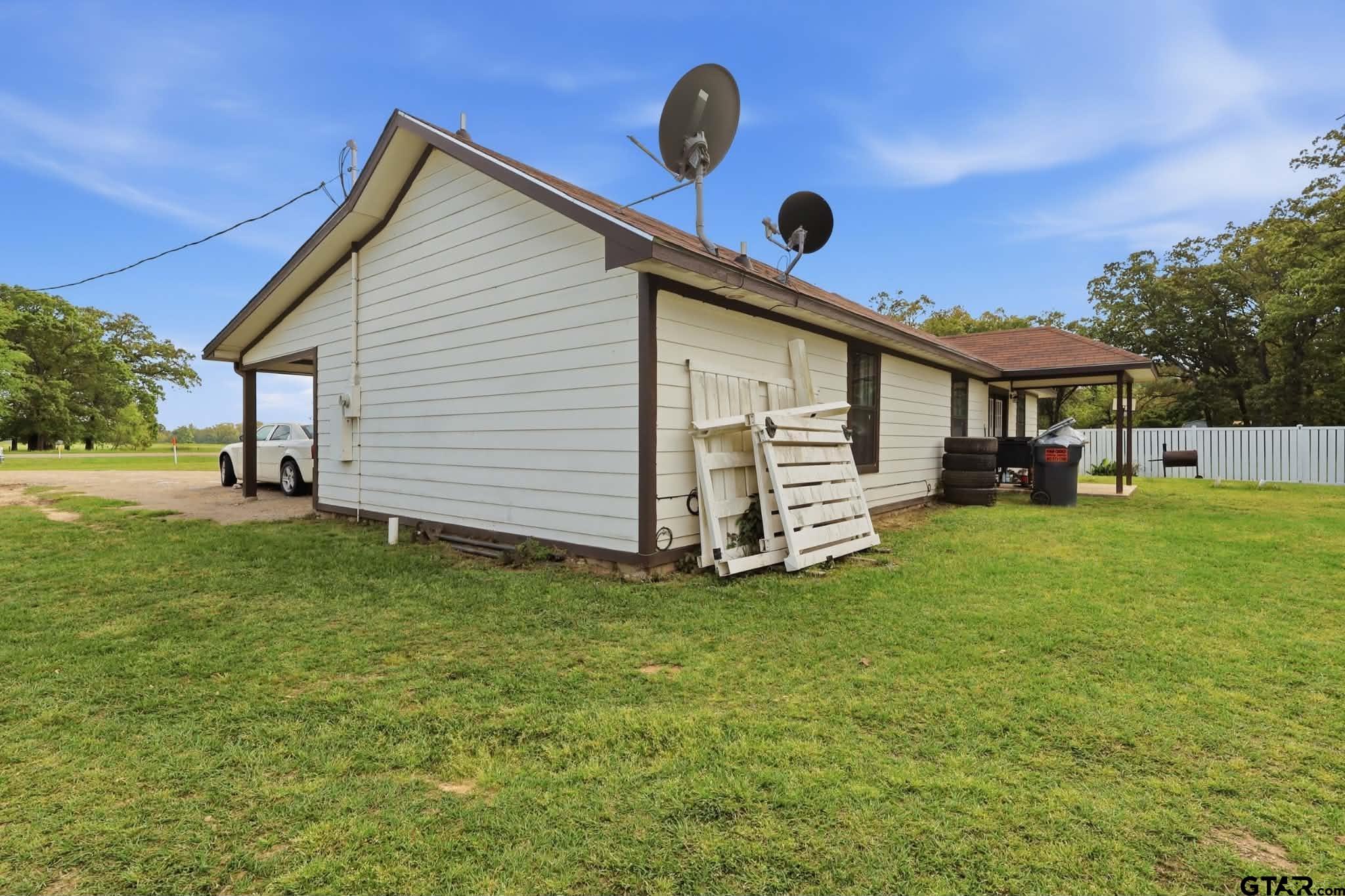 1933 Highway 11 Pittsburg, TX 75686 - Photo 22 of 34 a view of a house with backyard