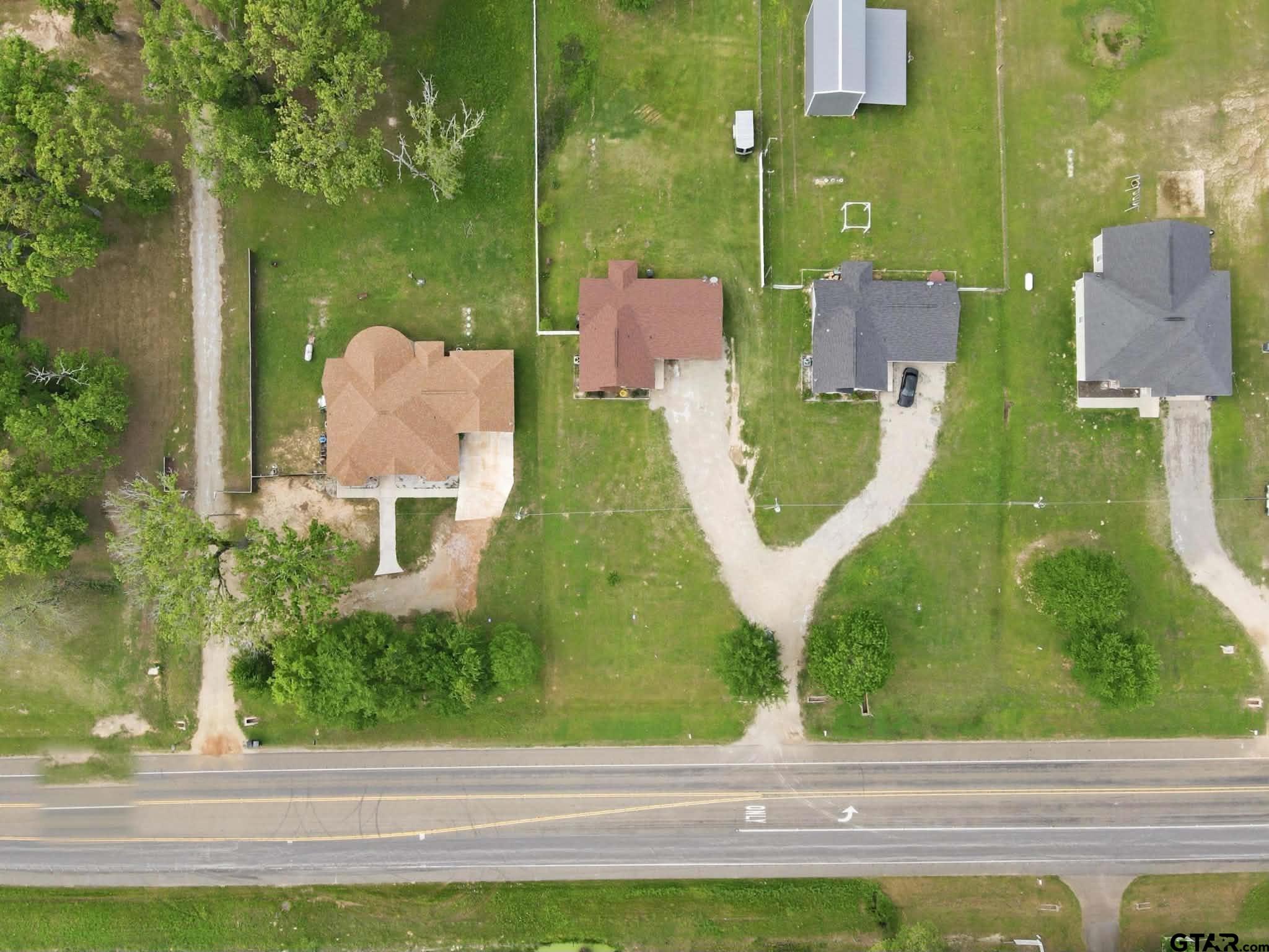 1933 Highway 11 Pittsburg, TX 75686 - Photo 25 of 34 an aerial view of a house with a garden and yard