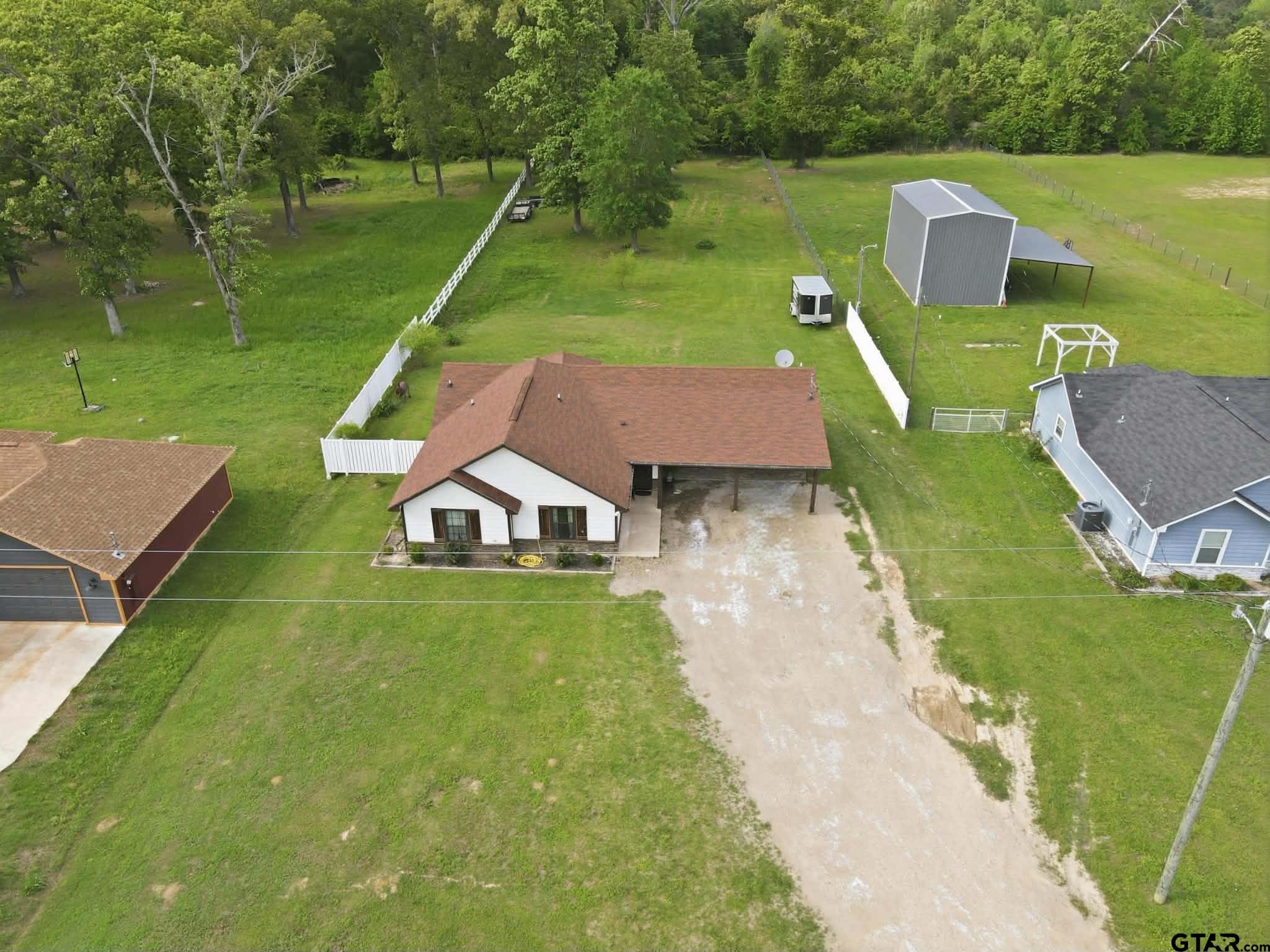 1933 Highway 11 Pittsburg, TX 75686 - Photo 32 of 34 an aerial view of a house with a big yard