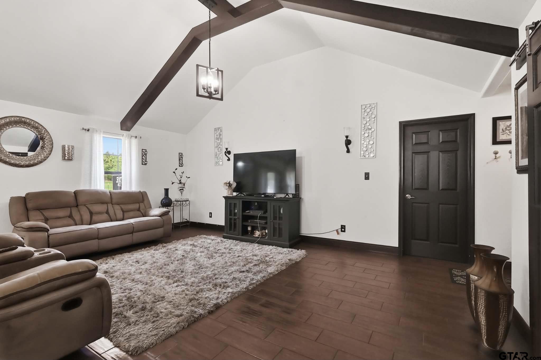 1933 Highway 11 Pittsburg, TX 75686 - Photo 5 of 34 a living room with furniture and a flat screen tv