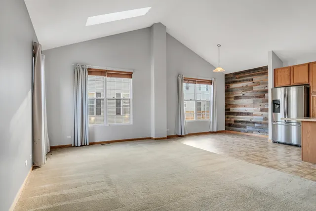 a view of an empty room with a closet