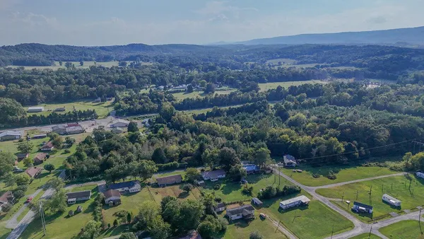 an aerial view of residential house and outdoor space