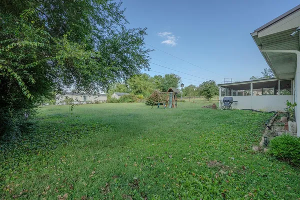 a view of backyard with green space