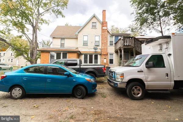 a view of a car parked in front of a house