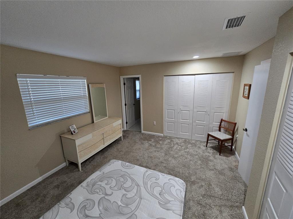 22200 Oneida Avenue Port Charlotte, FL 33952 - Photo 12 of 26 a living room with furniture and a rug