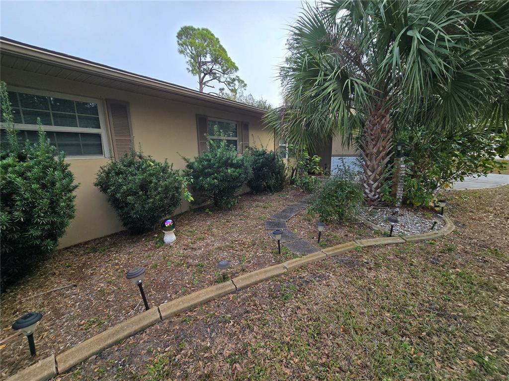 22200 Oneida Avenue Port Charlotte, FL 33952 - Photo 25 of 26 a view of a house with a yard