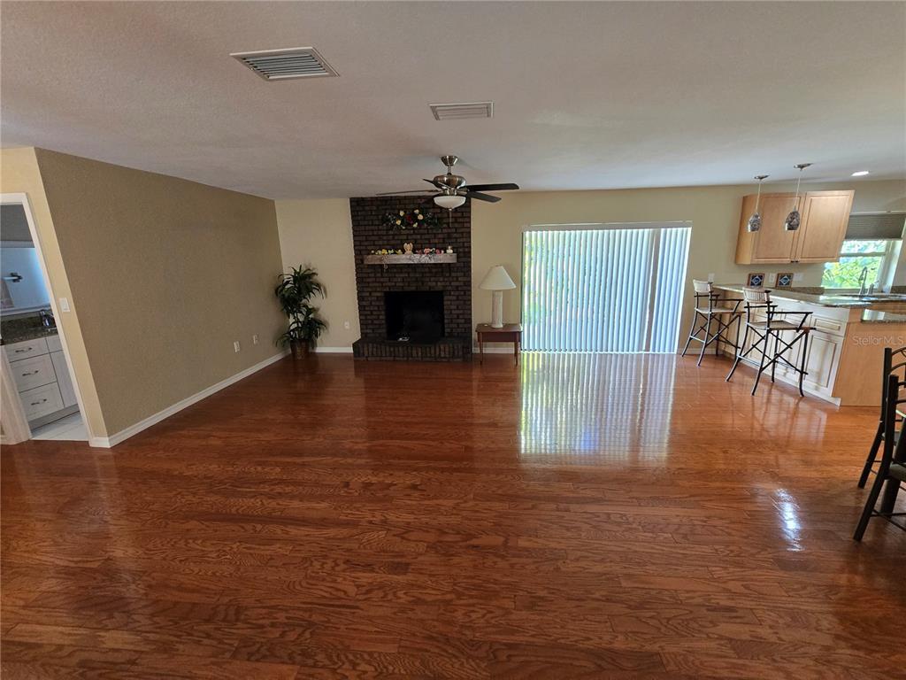 22200 Oneida Avenue Port Charlotte, FL 33952 - Photo 6 of 26 a view of empty room with wooden floor