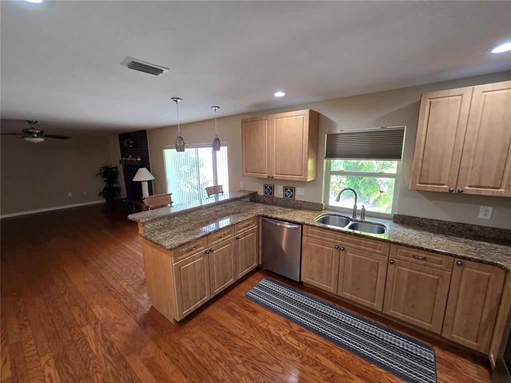 22200 Oneida Avenue Port Charlotte, FL 33952 - Photo 8 of 26 a kitchen with a stove and a sink
