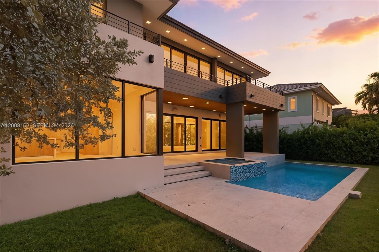 760 Woodcrest Road Key Biscayne, FL 33149 - Photo 5 of 43 a view of an house with backyard and garden